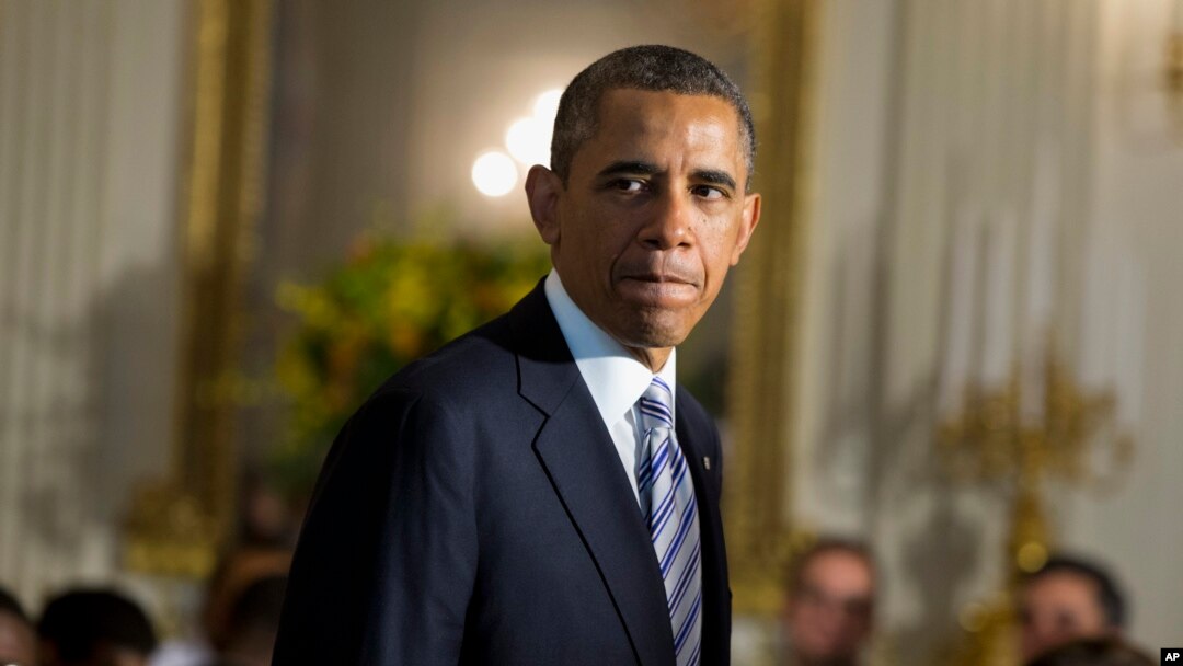 President Barack Obama arrives in the State Dining Room of the White House in Washington, June 14, 2013.