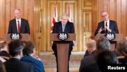 Britain's Prime Minister Boris Johnson, Chris Whitty, Chief Medical Officer for England and Chief Scientific Adviser to the Government, Sir Patrick Vallance, attend a news conference on the novel coronavirus, in London, March 3, 2020.