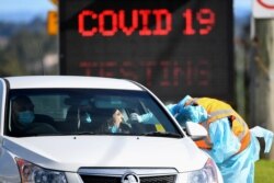 A member of the public is seen getting a test for the coronavirus disease (COVID-19) at the Crossroads Hotel testing centre following a cluster of infections in Sydney, Australia, July 16, 2020. (AAP Image/Bianca De Marchi via Reuters)