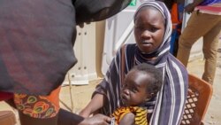 FILE- A baby has their arm measured to check for malnutrition at a refugee camp for people who crossed from Sudan, in Renk County, South Sudan, Wednesday, May 3, 2023. (Peter Louis/WFP via AP).