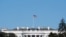 FILE - An American flag flies above the White House in Washington, Jan. 9, 2021. 