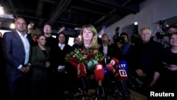 Leader of Social Democrats Vilija Blinkeviciute listens to the media after the second round of general elections, in Vilnius, Lithuania, Oct. 27, 2024.