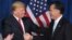 FILE Donald Trump (L) greets former Massachusetts Governor Mitt Romney in Las Vegas, Nevada, February 2, 2012. 