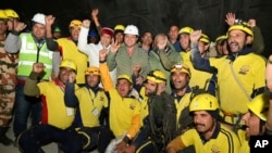 This photo shows the Indian workers pulled out of the tunnel on Tuesday, Nov. 28, 2023. (Uttarakhand State Department of Information and Public Relations via AP)