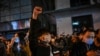 People sing slogans while gathering on a street in Shanghai on Nov. 27, 2022, where protests against China's zero-COVID policy took place following a deadly fire in Urumqi, the capital of the Xinjiang region.