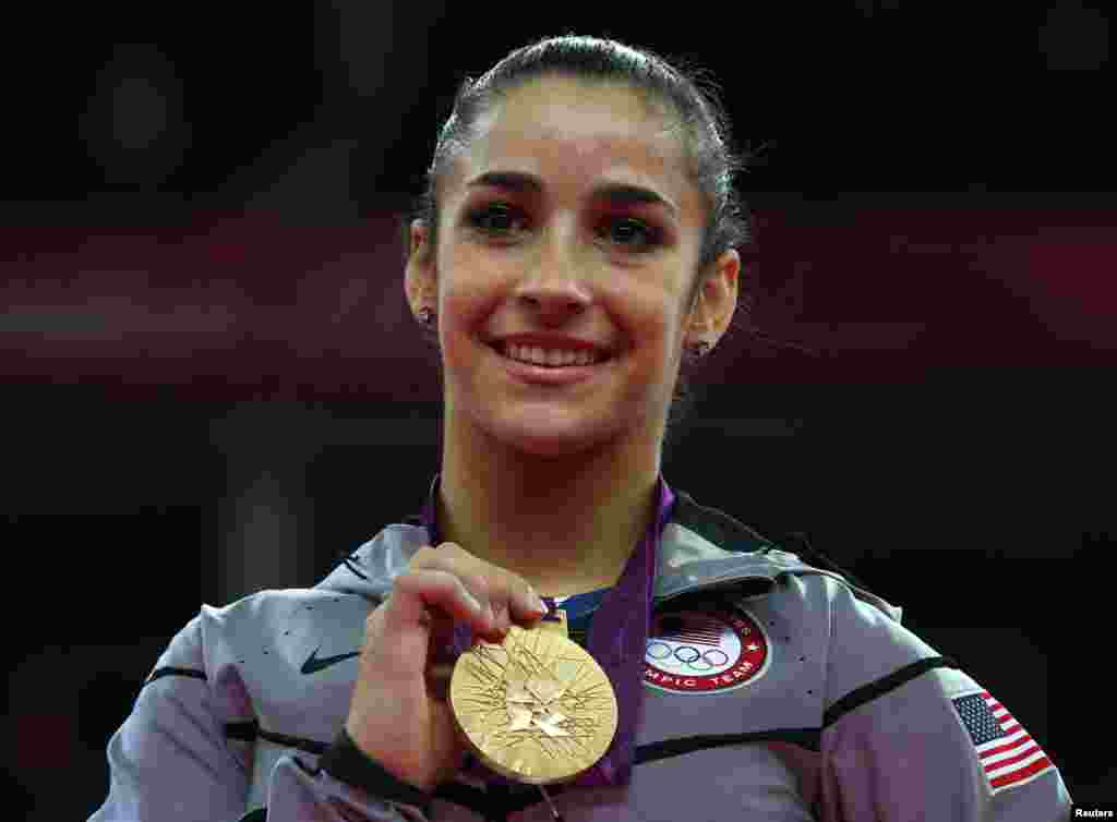 Alexandra Raisman of the U.S. celebrates winning a gold medal during the women's gymnastics floor exercise at the London 2012 Olympic Games, August 7, 2012. 