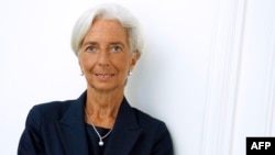 IMF chief Christine Lagarde poses on the sideline of a press conference, Aug. 27, 2014. 