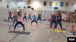 Teachers at Gunpowder Elementary school in Baltimore, MD, take part in a fitness class designed to reduce stress.