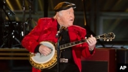 FILE - Roy Clark performs at the 50th annual CMA Awards at the Bridgestone Arena on Nov. 2, 2016, in Nashville, Tenn. 