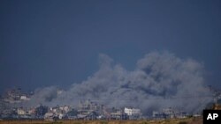 Smoke rises following an Israeli bombardment in the Gaza Strip, as seen from southern Israel, Wednesday, Dec. 6, 2023.