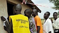 Residents of the remote south central Southern Sudan village of Nyal line up to register their names at a local school being used as a voter registration office, 15 Nov 2010.