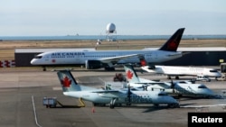 FILE - Air Canada airplanes are pictured at Vancouver's international airport in Richmond, British Columbia, Canada, Feb. 5, 2019. 