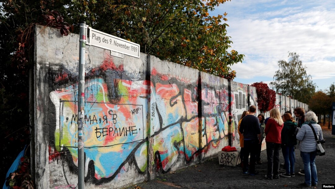 FILE - Remains of the Berlin Wall are pictured at former Bornholmer Strasse Berlin Wall border crossing point in Berlin, Germany, Oct. 18, 2019.