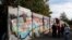 FILE - Remains of the Berlin Wall are pictured at former Bornholmer Strasse Berlin Wall border crossing point in Berlin, Germany, Oct. 18, 2019.
