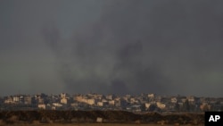 Smoke rises following an explosion in the Gaza Strip as seen from southern Israel, Dec. 5, 2024.