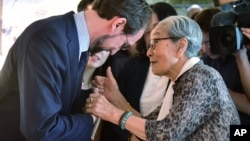 U.N. High Commissioner for Human Rights Zeid Ra'ad Al Hussein, left, is greeted by former South Korean comfort woman Kim Bock-dong, who was forced to serve for the Japanese troops as a sexual slave during World War II, as he visits the War and Women's Human Rights Museum in Seoul Wednesday, June 24, 2015. The United Nations opened a new office in Seoul on June 23 to monitor the human rights situation in North Korea. (Jung Yeon-je/Pool Photo via AP)