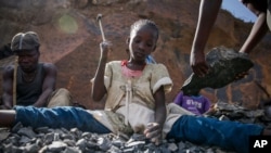 FILEIrene Wanzila, 10, works breaking rocks with a hammer at the Kayole quarry in Nairobi, Kenya, Sept. 29, 2020, along with her younger brother, older sister and mother.
