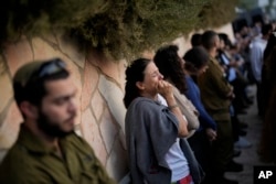 FILE - Mourners react during the funeral of Israeli soldier Benjamin Loeb, a dual Israeli-French citizen, in Jerusalem, Tuesday, Oct. 10, 2023. Loeb was killed on Saturday as the militant Hamas rulers of the Gaza Strip carried out an unprecedented, multi-front attack on Israel.