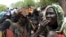 A handout picture from UNMIS shows internally displaced persons (IDP) waiting for the distribution of aid during a visit by UN humanitarian chief John Holmes in the town of Akobo in southern Sudan, 8 May 2009