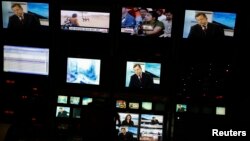 Screens are seen at the master control room of TV station Globovision in Caracas, May 28, 2013.