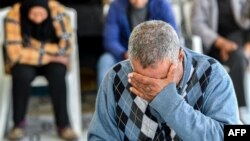 FILE—A family member of one of the Tunisian migrants who were lost at sea in January reacts during a gathering in Hencha, about 45 kilometers north of Sfax in central Tunisia, on April 23, 2024.