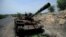 FILE - A tank damaged during the fighting between Ethiopia's National Defense Force and Tigray Special Forces stands on the outskirts of Humera, Ethiopia, July 1, 2021. 
