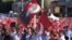 Demonstrators at Taksim Square wave flags bearing the face of Mustafa Kemal Ataturk, revered as founder of the modern Turkish Republic, July 24, 2016. Many are calling for preservation of the secular state established by Ataturk nearly a century ago. (L. Ramirez/VOA)