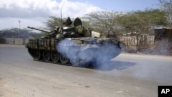 African Union Mission to Somalia (AMISOM) peacekeepers patrol in their tanks along a main road in Hodan district in of the capital Mogadishu, Somalia, March 4, 2011