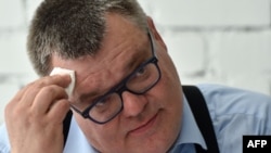 Presidential candidate Viktor Babaryko is seen in Minsk, June 11, 2020. In the lead-up to the August 9 election, he was arrested on suspicion of financial crimes, and scores opposing the Belarusian regime were detained. Those held included 14 journalists.