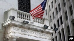 FILE - The New York Stock Exchange is seen Aug. 24, 2015. U.S. stocks are opening slightly higher Nov. 20, 2017, as technology companies and retailers make gains.