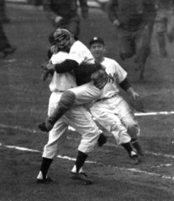 FILE- New York Yankees catcher Yogi Berra embraces pitcher Don Larsen as he leaps into Larsen's arms at the end of Game 5 of the World Series against the Brooklyn Dodgers at New York's Yankee Stadium, Oct. 8, 1956. Larsen pitched a perfect game.
