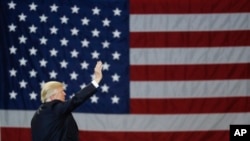 President Donald Trump with the US flag