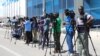 FILE - Reporters are seen during a stake-out in Mogadishu, Somalia, Dec. 29, 2019. The Somali government recently directed journalists to replace the name used for the Islamist extremist group "al-Shabab" with "khawarij," which means "a deviation from Islam."