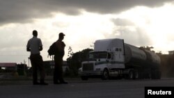 A tanker truck travels on a road in Mayabeque province, Cuba, Oct.15, 2015. 