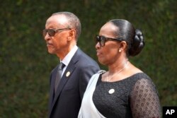 FILE—Rwandan President Paul Kagame, left, and his wife, first lady Jeannette Kagame at the Kigali Genocide Memorial, in Kigali, Rwanda, April 7, 2024.