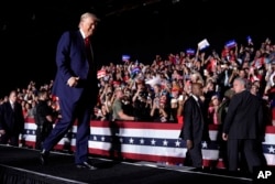 Former President Donald Trump, the Republican nominee for president in 2024, walks after speaking at a campaign rally, Oct. 18, 2024, in Detroit.