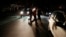 People walk on a street during a blackout in Caracas, Venezuela, Dec. 2, 2013.