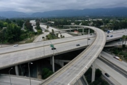 FILE - An empty freeway intersection is seen two days before Earth Day, after Los Angeles’ stay-at-home order caused a drop in pollution, as the global outbreak of the coronavirus continues, in Pasadena, near Los Angeles, California, April 20, 2020.