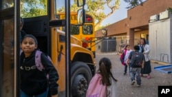 Social idiosyncratic    Mary Schmauss, rear right, greets students arsenic  they get  for schoolhouse  astatine  Algodones Elementary School successful  Algodones, New Mexico, Oct. 1, 2024.