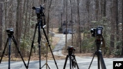 Television news cameras are lined up outside of the house where Germanwings A320 plane crash victim Yvonne Selke is presumed to have lived in Nokesville, Virginia, March 25, 2015.