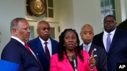 Sherrilyn Ifill, center, of the NAACP Legal Defense Fund, speaks with reporters outside the West Wing of the White House in Washington, July 8, 2021, following a meeting with President Joe Biden and leadership of top civil rights organizations.