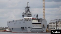 FILE - This Mistral helicopter carrier, the Vladivostok, is seen at the STX Les Chantiers de l'Atlantique shipyard site in Saint-Nazaire, western France, April 24, 2014. 