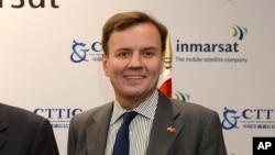 FILE - Greg Hands, the then Chief Secretary to the Treasury, poses for a photograph during a visit to Inmarsat in London, Thursday, Oct. 22, 2015. 