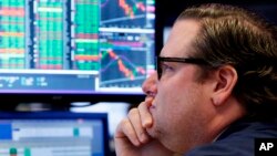 Specialist Gregg Maloney works at his post on the floor of the New York Stock Exchange, in New York, April 23, 2018.