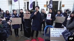 FILE - Hong Kong activist Tony Chung takes part in a protest against Hong Kong's Basic Law Article 23, in London, March 23, 2024.