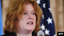 FILE - Assistant Secretary for Population, Refugees, and Migration, Anne C. Richard speaks at an event in recognition of World Refugee Day at the State Department, June 20, 2013. 