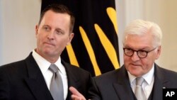 German President Frank-Walter Steinmeier, right, gestures during the accreditation of the U.S. Ambassador in Germany, Richard Grenell, left, at the Belevue palace in Berlin, Germany, May 8, 2018.