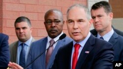 FILE - Environmental Protection Agency Administrator Scott Pruitt speaks at a news conference with Pasquale "Nino" Perrotta (2nd-L) in East Chicago, Ind., April 19, 2017. 