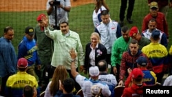 Venezuela President Nicolas Maduro waves at crowd during the opening ceremony for the Alba Games in Macuto, Venezuela, April 21, 2023.