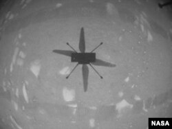NASA’s Ingenuity Mars Helicopter captured this shot as it hovered over the Martian surface on Apr. 19, 2021, during the first instance of powered, controlled flight on another planet. (NASA/JPL-Caltech)